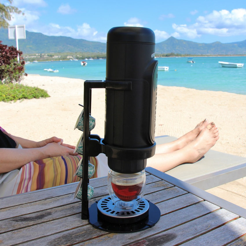 NowPresso Portable Espresso Machine Stand drinking Iced Coffee at Beach